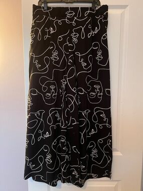 torrid Black wide leg pants with abstract face print